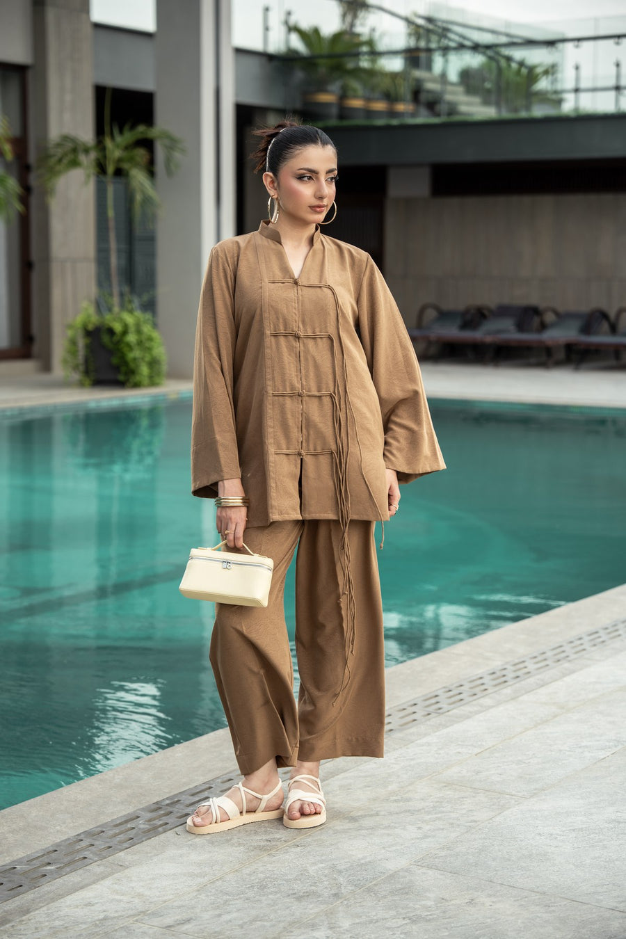 Dune co-ord full length beside the pool.