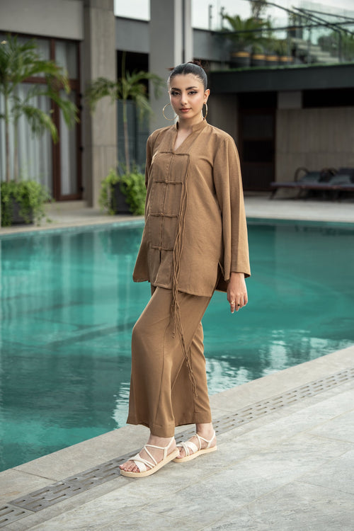 Dune co-ord seen from the front, showing the V neckline and the straight fall of the georgette.