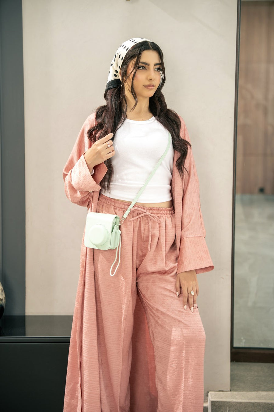 The Blush kimono worn open, the wide cuffs folded back.