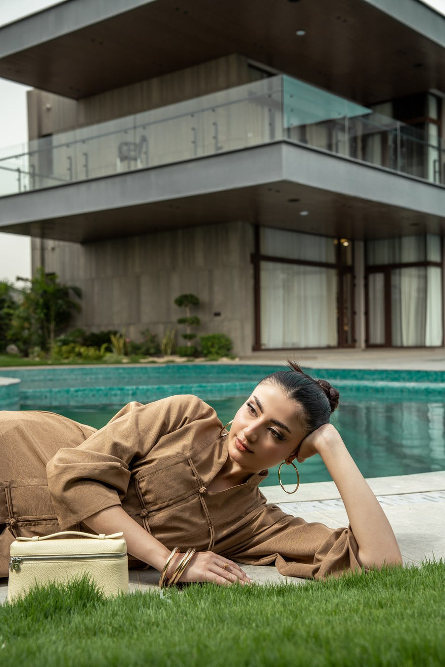 Dune co-ord photographed on the grass beside the pool.