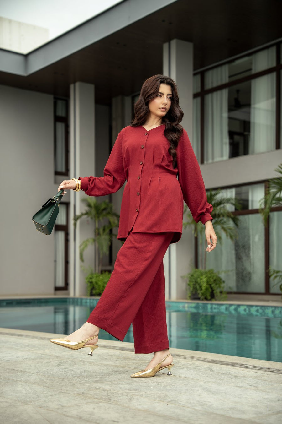 Ruby co-ord mid stride beside the pool.