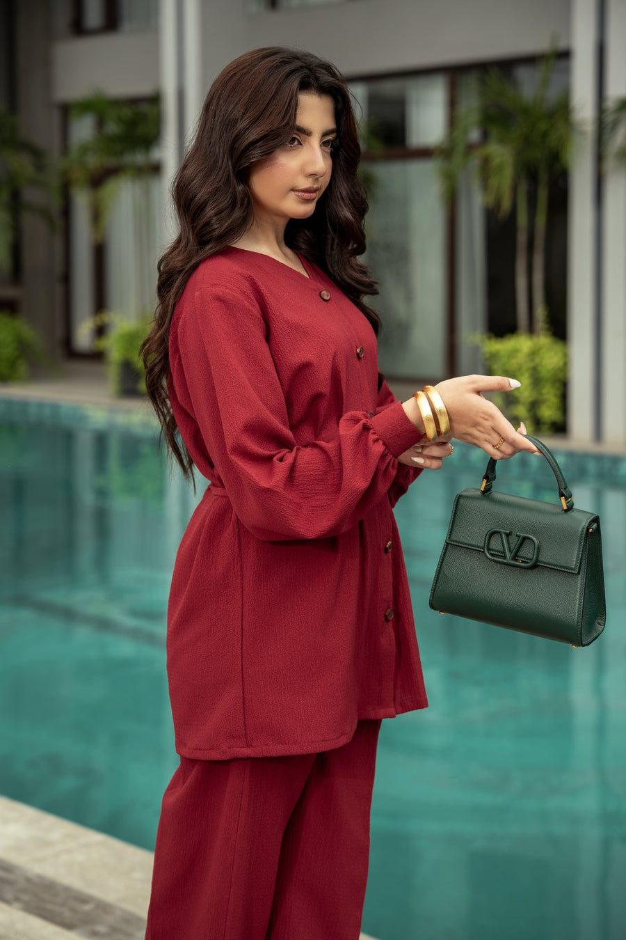 Ruby co-ord three-quarter, the pleated waist in view.