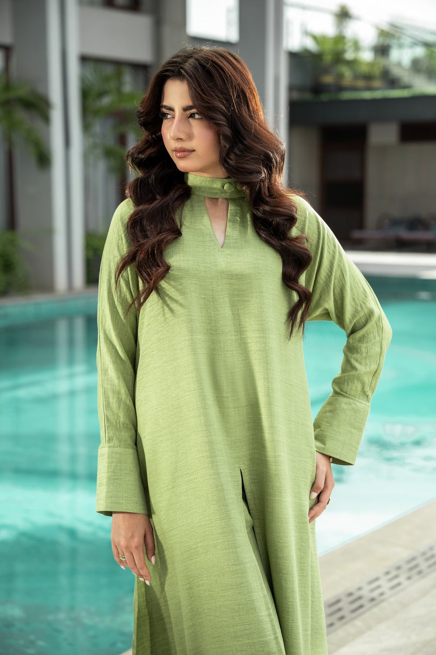 Sage shirt from the waist up, the mandarin collar in view.