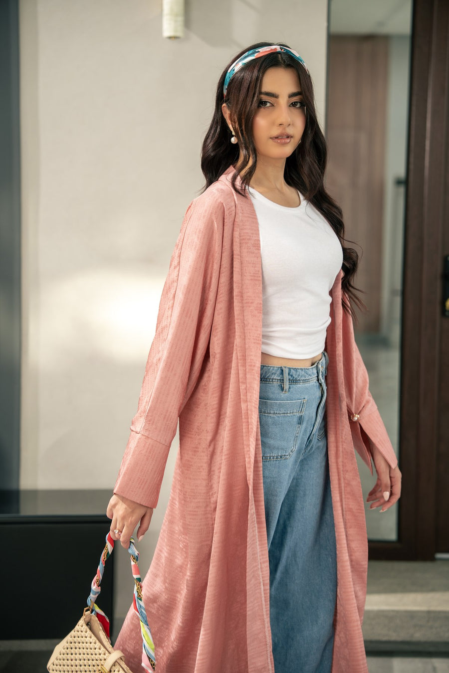 The Blush kimono worn open over jeans.