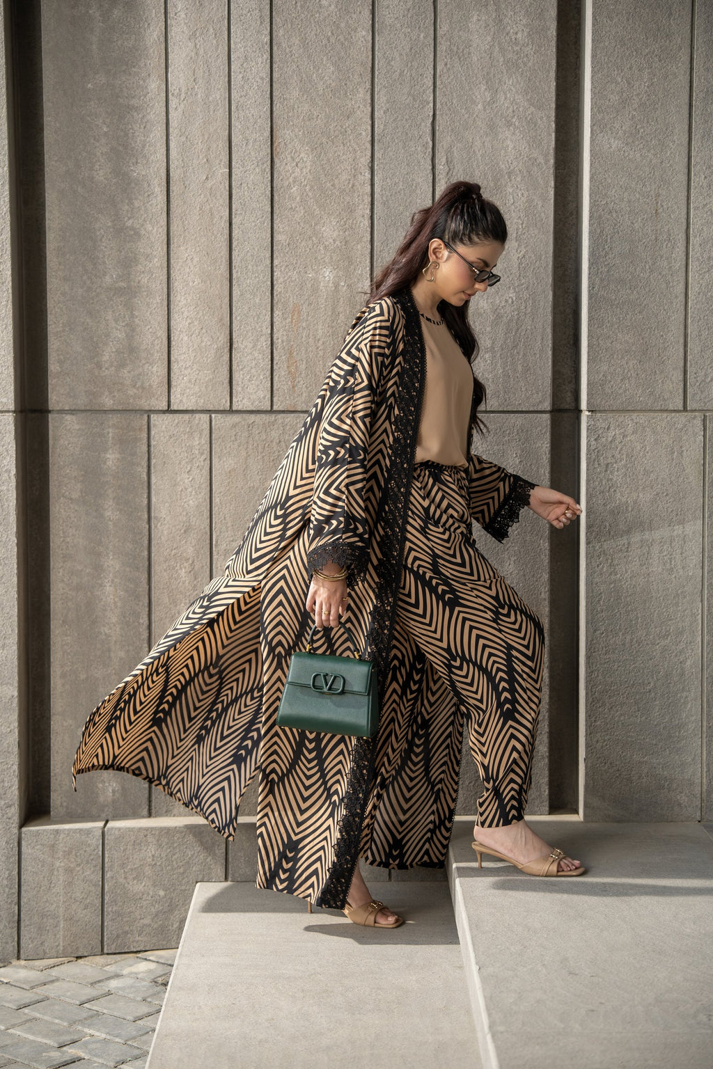 Onyx kimono set in mid step, the printed kimono opening over the matching trousers.