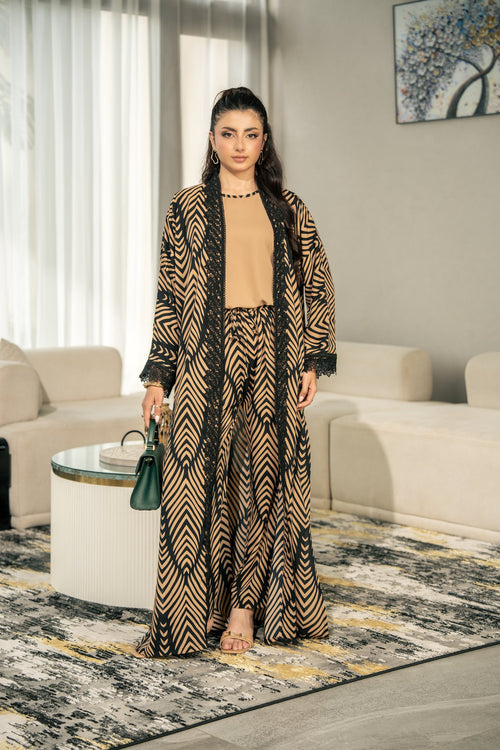 Onyx kimono set worn as all three pieces, the kimono open over the camel inner and printed trousers.