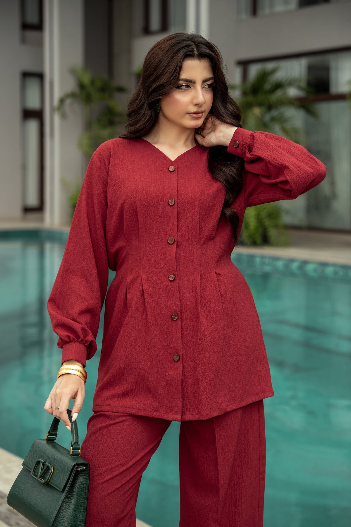 The Ruby shirt from the front, showing the buttoned placket and the pleated waist.